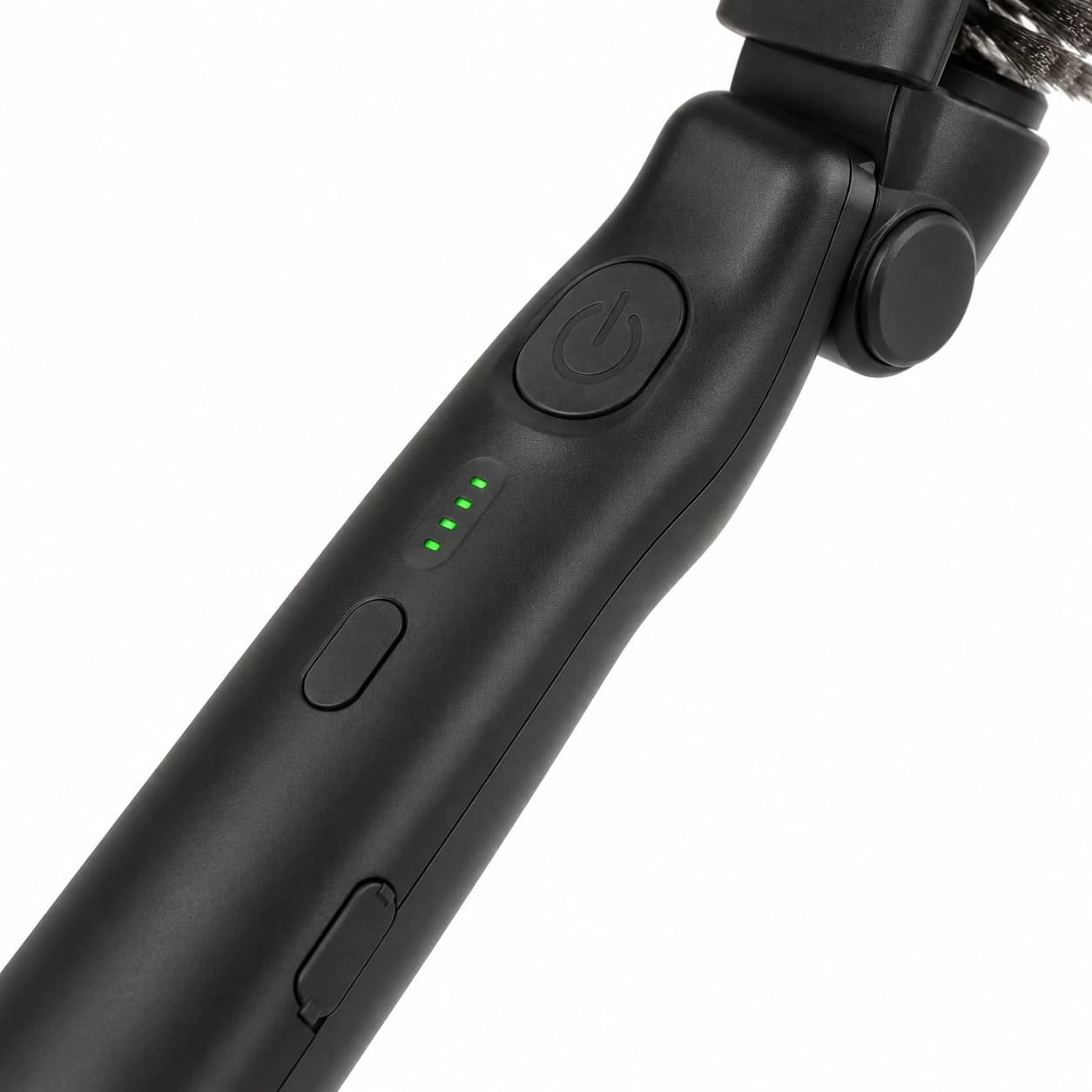 Bouton poussoir, voyants verts et bouton de réglage sur le manche de la brosse électrique