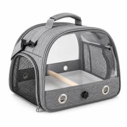 Sac de transport pour oiseau en tissu gris chiné, posé de trois quarts, perchoir et plateau en place