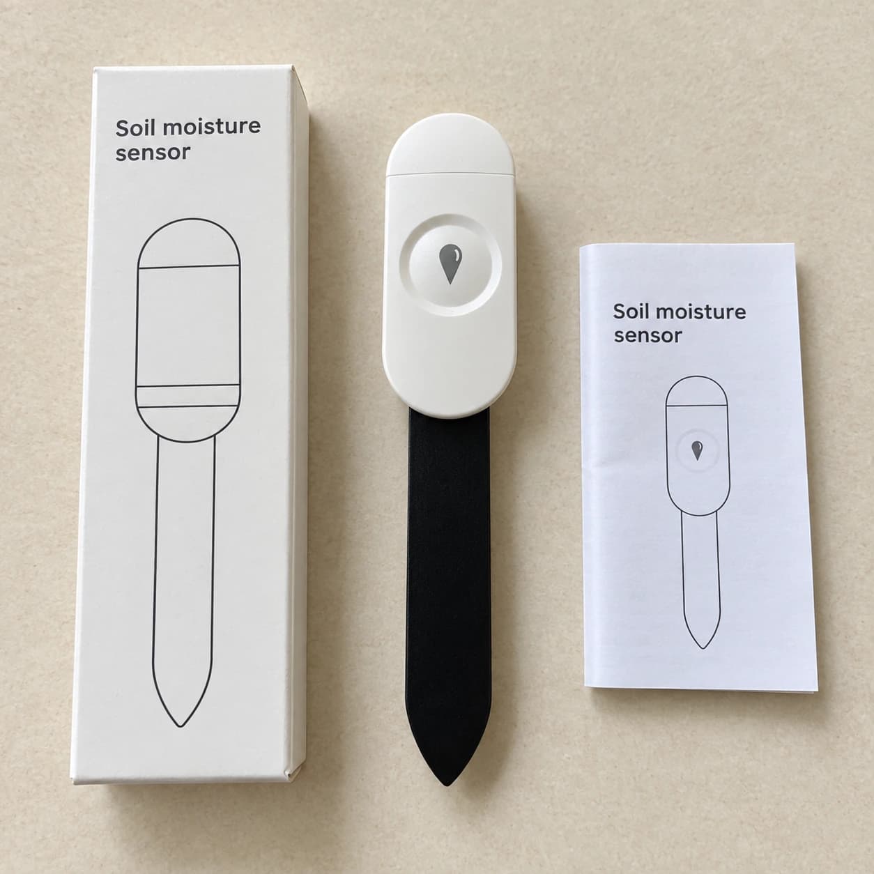 Capteur Zigbee avec sa boîte et sa notice