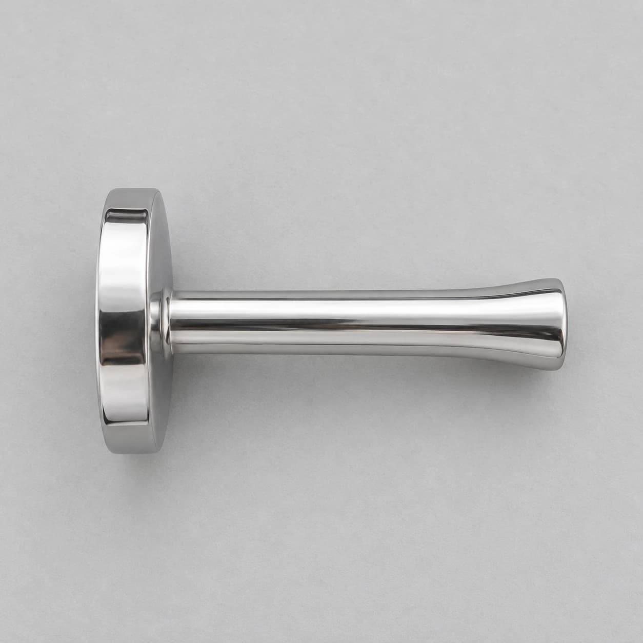 Contenu du colis : le pilon en inox seul, posé à plat, vu de dessus