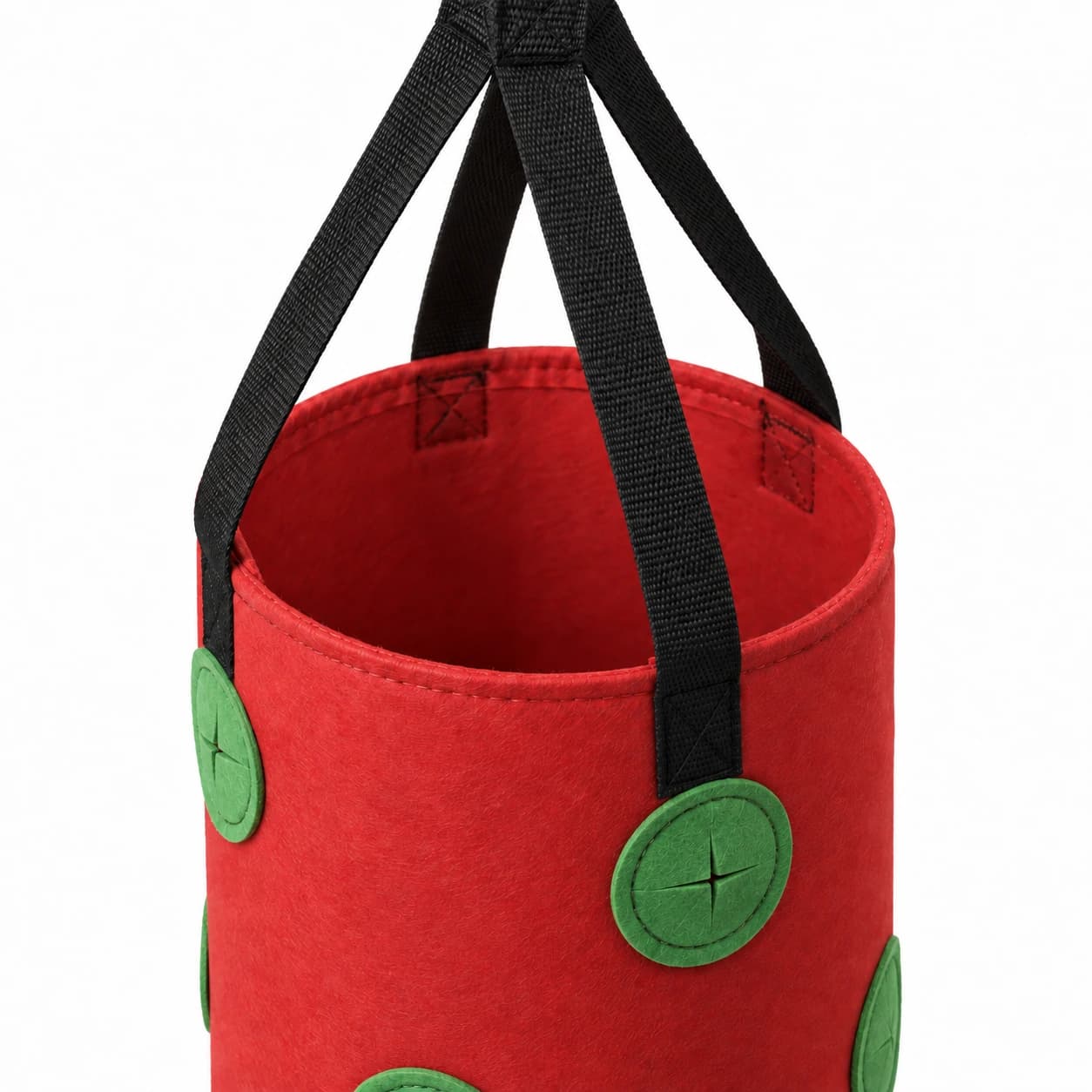 Le haut du sac rouge ouvert, quatre sangles noires réunies en un seul point d'accroche